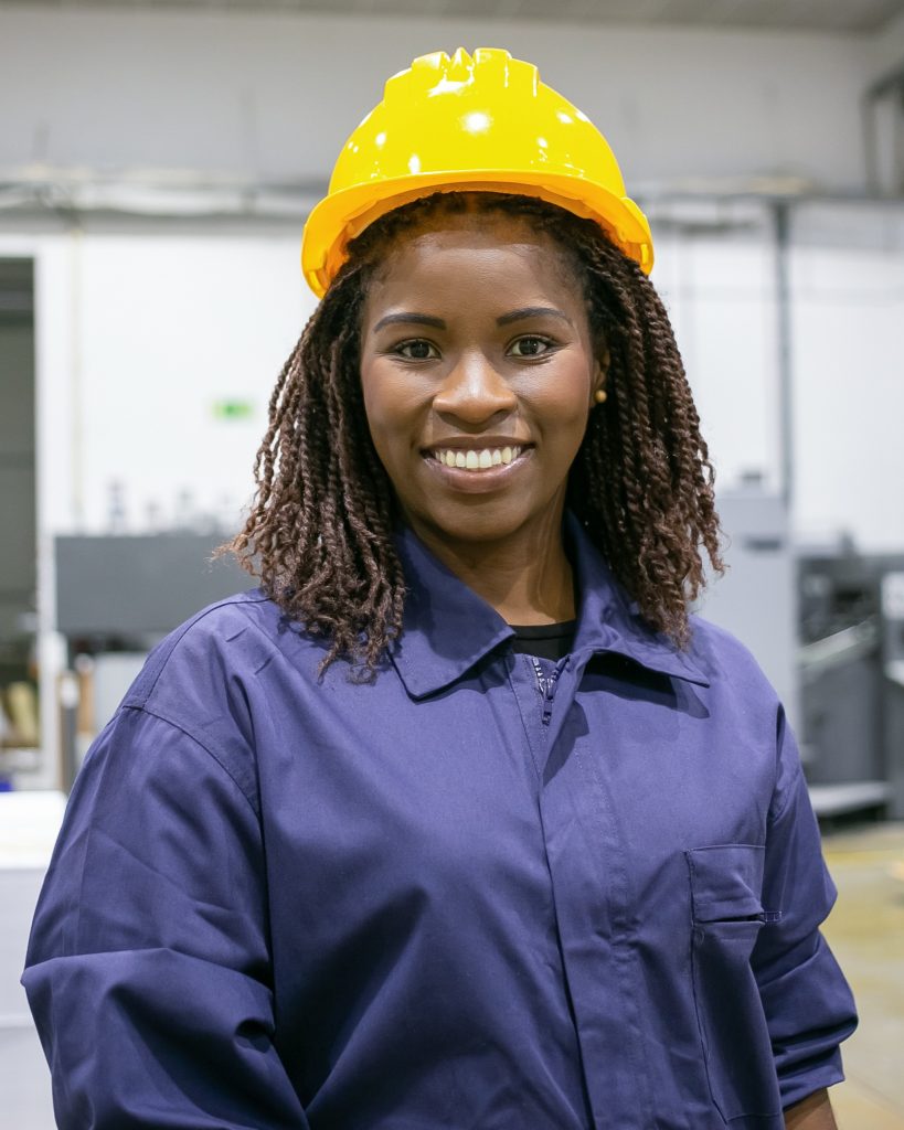Cheerful African American female factory employee